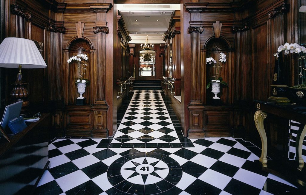 A hallway with a black and white checkered floor.