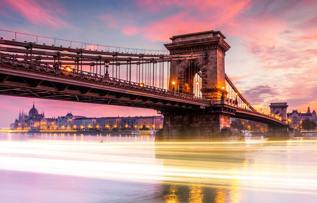 The chain bridge in budapest, hungary at sunset.
