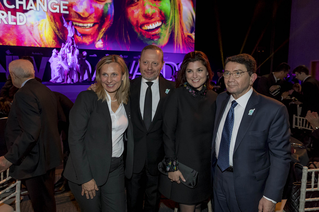A group of people posing for a photo at an event.